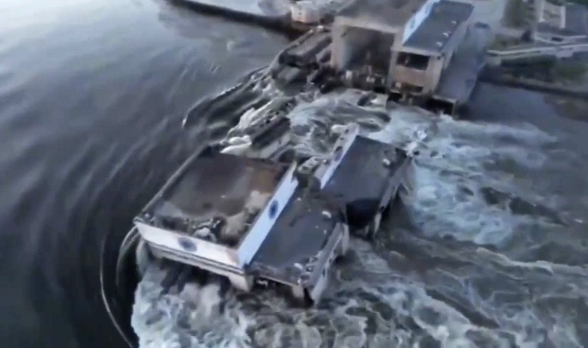 In this image taken from video released by the Ukrainian Presidential Office, water runs through a breakthrough in the Kakhovka dam in Kakhovka, Ukraine, Tuesday, June 6, 2023. Ukraine on Tuesday accused Russian forces of blowing up the major dam and hydroelectric power station in a part of southern Ukraine that Russia controls, sending water gushing from the breached facility and risking massive flooding. Russian officials countered that the dam was damaged by Ukrainian military strikes in the contested area. (Ukrainian Presidential Office via AP)  XEL105
