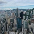 Honkonge tarybų nariai prisiekė ištikimybę Pekinui, atsistatydinus šimtams jų kolegų