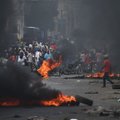 Protestai Haityje paralyžiavo visuomeninį gyvenimą
