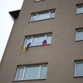 Rusijos vėliavas pro bendrabučio langus iškėlę studentai sukėlė solidarumo akciją