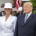 Pasaulis eina iš proto: balta Melanios Trump skrybėlė turėjo užslėptą reikšmę?