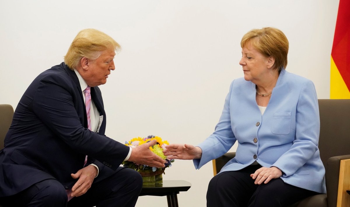 Prasidedant sunkiam G-20 susitikimui Trumpas uždavė taikesnį toną