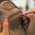 Valstybės jubiliejų kinai pasitinka su patriotinėmis šukuosenomis
