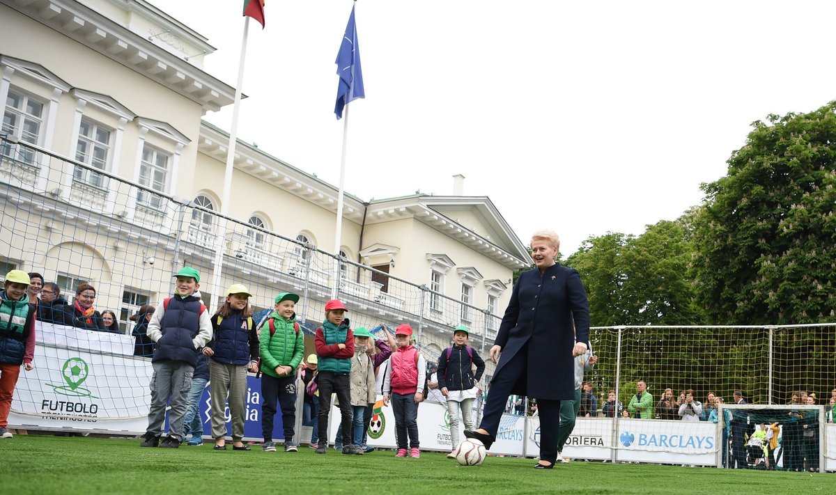 President Grybauskaitė plays football in the front of the Presidential palace in Vilnius.  July 2 2017