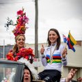 Gold-winning cyclist waves Lithuanian flag at parade in Australia