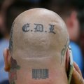 Britas suimtas už tatuiruotę