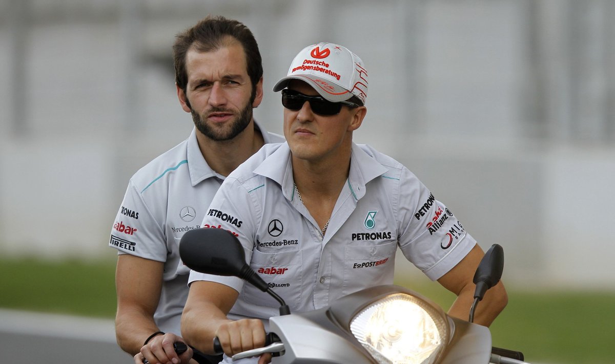 Michaelis Schumacheris su savo komandos nariu