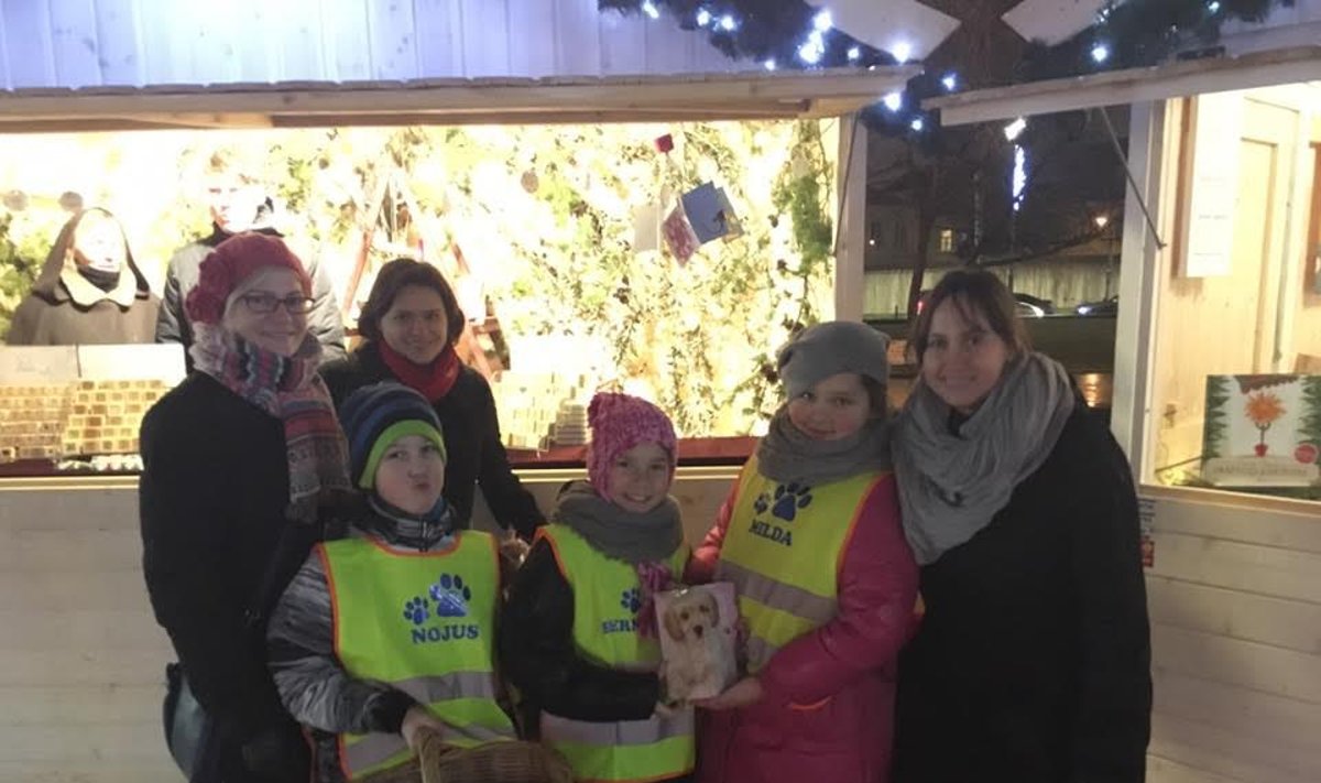Children selling sweets to raise funds for an animal charity