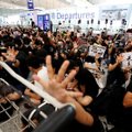 Honkongo oro uosto išvykstantys skrydžiai vėl užblokuoti dėl protestų