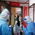 Kinijoje užregistruota rekordiškai daug naujų COVID-19 atvejų