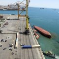 Irano uoste apvirto kraunamas konteinerinis laivas