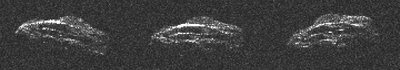 Trijose Arecibo radaro spektro teleskopo užfiksuotose 2011 UW158 nuotraukose matoma 4 minučių atkarpa iš 37 minutes trunkančio sukimosi periodo. Vienas paveikslėlio taškas atitinka 7,5 metro. Asteroido paviršius primena migdolo riešutą, kuriame išilgai asteroido įžiūrimos lygiagrečios linijos (Arecibo observatorijos nuotr.)