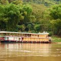Sveiki atvykę į Laosą: turistų stumiami autobusai ir lėčiausi pasaulyje laivai