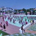 Šiaurės Korėjos gyventojai mėgaujasi vasara Pchenjano vandens parke