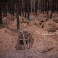Iziume perlaidojami ekshumuotų Rusijos agresijos aukų palaikai