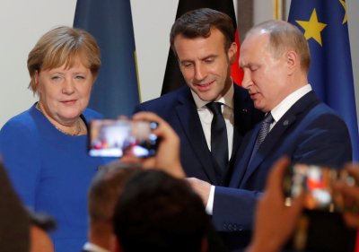 Angela Merkel, Emmanuelis Macronas, Vladimiras Putinas
