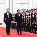Xi Jinpingui viešint Prancūzijoje, Macronas siekia sutelkti ES prieš Pekino ambicijas