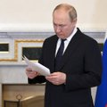 Putinas pirmą kartą po įsiveržimo į Ukrainą vyks į užsienį