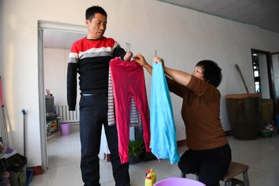 Kinija susiduria su drabužių perdirbimo problema