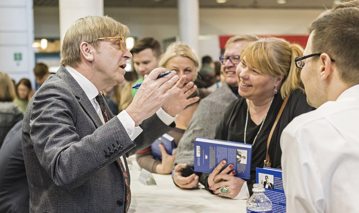 Even when signing books always the consumate politician, Guy Verhofstadt at the  Vilnius Book Fair  Photo © Ludo Segers @ The Lithuania Tribune