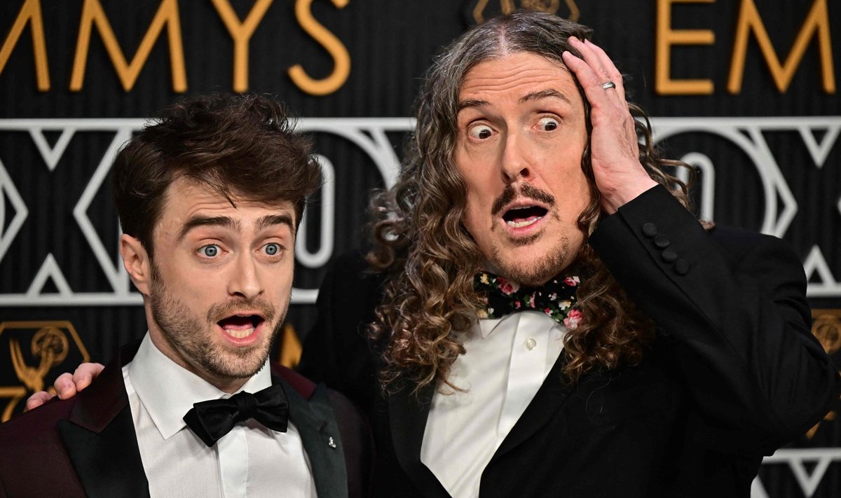 British actor Daniel Radcliffe (L) and US musician Al Yankovic arrive for the 75th Emmy Awards at the Peacock Theatre at L.A. Live in Los Angeles on January 15, 2024. (Photo by Frederic J. Brown / AFP)