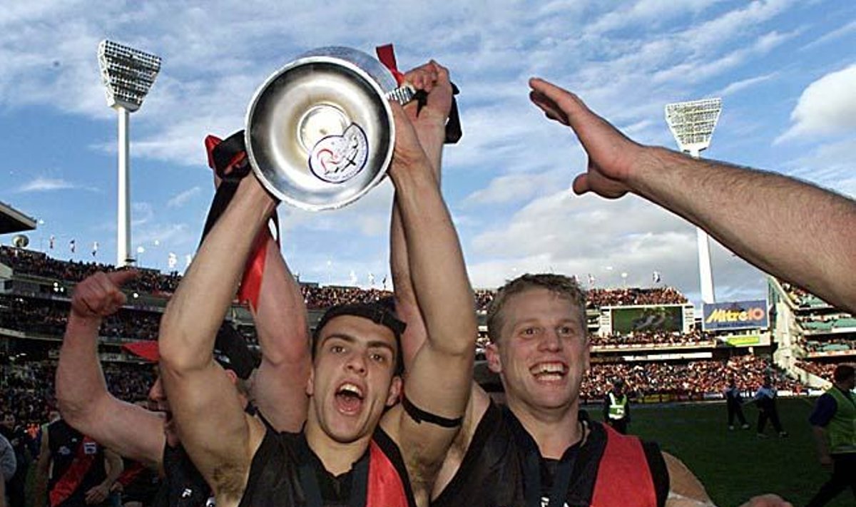 19-year-old Adam Ramanauskas celebrates the 2000 AFL Premiership with Mark Johnson.