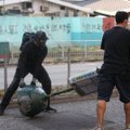 Honkongo isteblišmento sutriuškinimas per vietos rinkimus siunčia griežtą žinią Pekinui