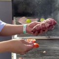 Argentinos grilio meistrai demonstravo mėsos kepimo technikos „asado“ įgūdžius