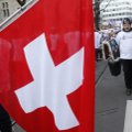 Šveicarija trumpina karantiną vildamasi, kad omikron yra pandemijos „pabaigos pradžia“