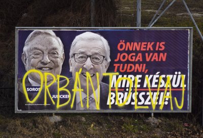 George'as Sorosas ir Jean-Claude Junckeris plakate
