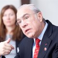 OECD head says Lithuania's economy is stable but gives no date for accession