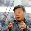 Kinijoje oficialiai suimtas tarptautinį pripažinimą pelnęs žurnalistas fotografas