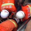 Kinijoje stipriai sužalotas eskalatoriuje užstrigęs žmogus