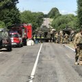 Aiškėja į avariją patekusių NATO karių likimas, policija užsimena apie apgadintą civilio automobilį