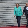 Merkel vizitas Kinijoje: tikisi greitos JAV-Kinijos prekybos karo pabaigos