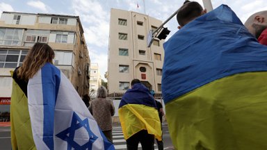 Ar ukrainiečiai protestavo prieš paramą Izraeliui su necenzūriniais plakatais rankose?