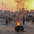 Ginkluotiems vyrams užpuolus protestuotojus Bagdade žuvo dešimtys žmonių