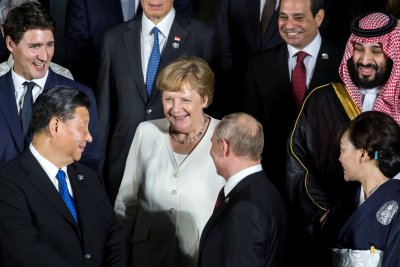 Xi Jinpingas, Angela Merkel, Vladimiras Putinas