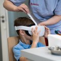 Vilniaus klinikoje nuo adatų baimės gelbsti VR akiniai: vaikai net nepastebi, kai jiems įduria
