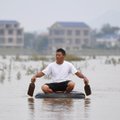 Kinijoje per potvynius žuvo 61 žmogus