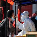 Kinijoje dėl COVID-19 protrūkio skelbiamas griežtas karantinas 13 mln. miesto gyventojų