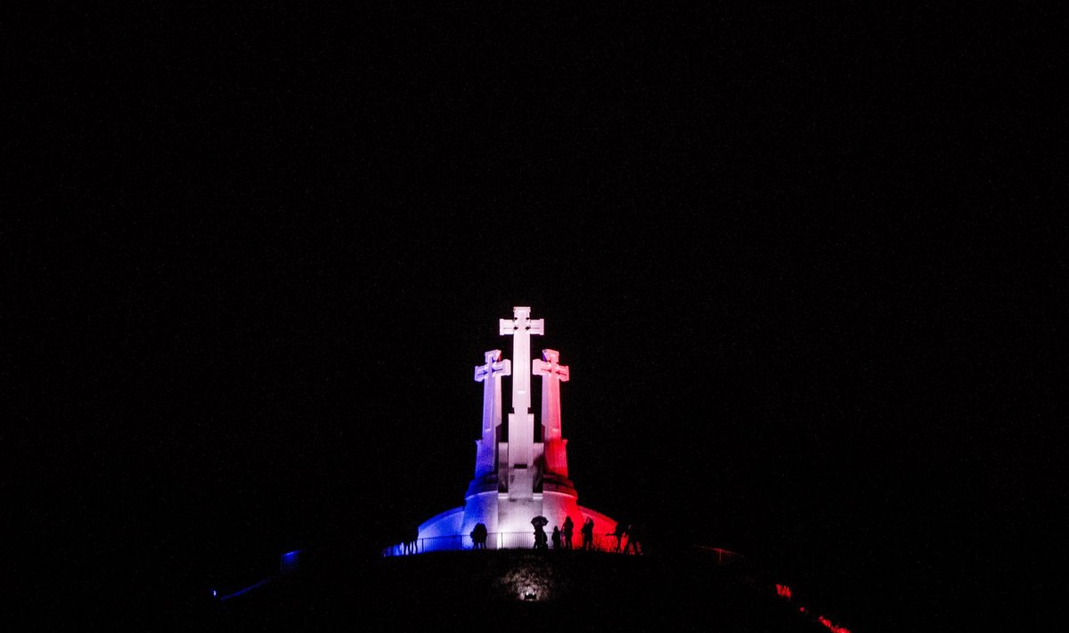 Three crosses coloured in the French flag colours 