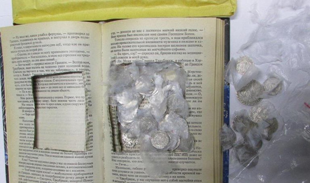Old coins found inside a book. Photo: Customs Department