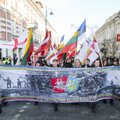 Vilniaus centre nešini plakatais ir vėliavomis žygiavo tautininkai