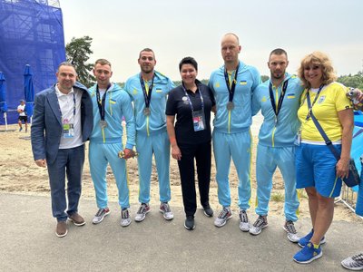 Daina Gudzinevičiūtė, Ukrainos nacionalinio olimpinio komiteto prezidentas Vadimas Gucaitas (kairėje)