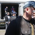Nyderlandų tyrėjai apžiūri rytų Ukrainoje surinktus Malaizijos lainerio katastrofos aukų palaikus